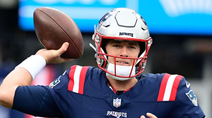 Patriots quarterback Mac Jones warms up before a game.